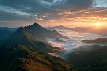 Majestic mountain landscape under golden sunset with clouds and fog in high altitude wilderness