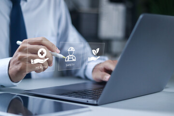 HSE, Health safety environment concept. Standard safe industrial work and industrial. business and organization. Businessman use laptop with virtual icon.