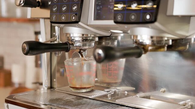 hot tea or coffee are pouring from coffee machine. 