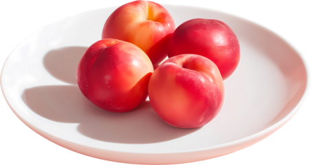 red plums on a plate