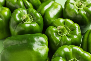 Tasty green bell peppers as background, closeup