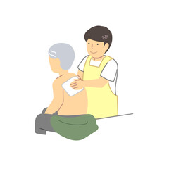 介護：体を拭く介助高齢者