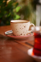 Warm cup of coffee on a rustic wooden table