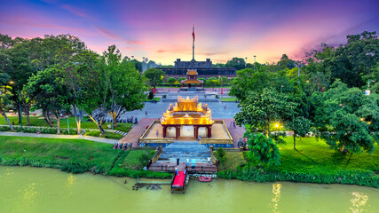Aerial view of Phu Van Lau Pavilion (Pavilion of Edicts) in front of the Flag Tower of the Citadel in Hue, Vietnam. The flag of Vietnam fluttering over the Citadel.
