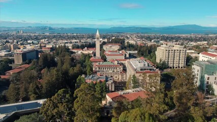 Aerial view of UC Berkeley's iconic Campanile clock tower and campus buildings, showcasing the university's architecture and urban setting in California, USA.