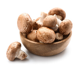 Wooden bowl with raw champignon mushrooms isolated on white background, closeup