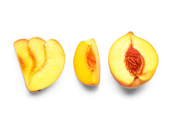 Cut sweet ripe peach on white background
