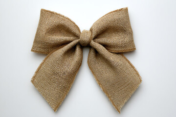 Rustic burlap bow made from coarse woven fabric, tied neatly with two loops and two tails, displayed on a plain white background
