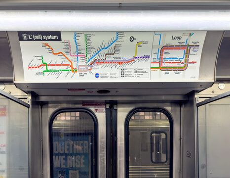 Chicago, Illinois, USA. Sep 11, 2025. A detailed CTA 'L' train map is shown above the train doors, guiding riders through Chicago's complex public transit system with color-coded lines.