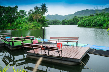 Obraz premium Floating terrace on the river that for outdoor meeting or party to close the nature with lake, forest and mountain at Thailand.