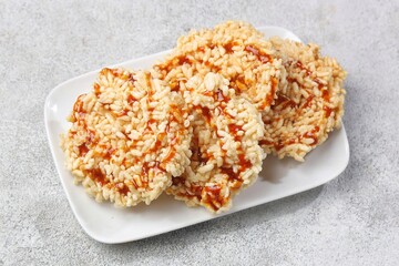 Rengginang Madu. Honey rengginang with Javanese sugar and honey topping is very delicious and crunchy.