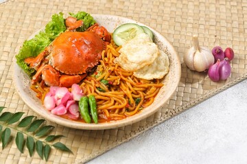Kepiting Mie Aceh. Aceh Noodle Crab is a typical food from the Aceh region which is usually noodles with strong curry spices and combined with crab