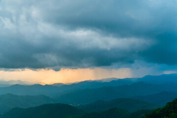 Landscape of Morning Mist with Mountain Layer. mountain ridge and clouds in rural jungle bush forest