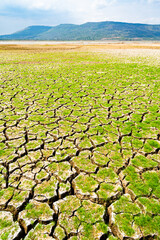 The ground is cracked because the water has dried up and there has been no rain.