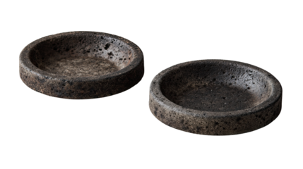 Two circular, shallow bowls, dark gray/brown, textured like volcanic rock
