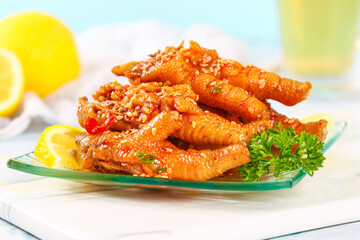 Spicy Glazed Chicken Feet with Lemon and Sesame Seeds - Traditional Asian Cuisine Appetizer