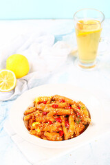 Spicy braised chicken feet with chilies and lemon garnish - Asian comfort food cuisine