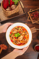 Spicy Mushroom Stir Fry with Fresh Vegetables and Red Peppers in Bowl on Wooden Table