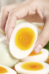 Hands Protecting Fresh Hard-Boiled Eggs with Golden Yolks - Farm Fresh Natural Food