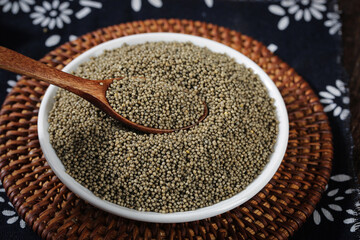 Traditional Shanxi Highland Black Millet Grains in Bowl - Organic Superfood Ingredients for Healthy Porridge and Cooking