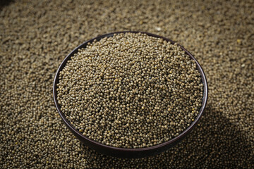 Organic Millet Grains in Black Bowl - Healthy Whole Grain Cereal and Superfood Ingredient