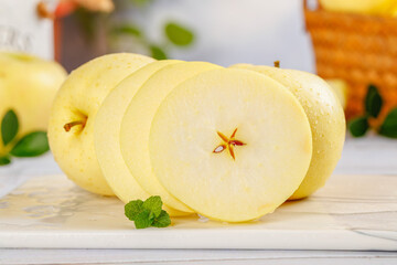 Fresh Golden Apple Slices from Aomori Region Japan with Mint on Wooden Background