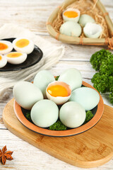 Fresh Green Duck Eggs with Golden Yolks on Rustic Farmhouse Kitchen Table