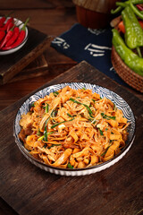 Homemade Asian Stir-Fried Noodles with Bean Sprouts and Vegetables on Wooden Table