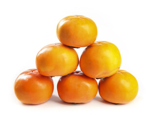 Fresh Crisp Persimmons Stacked on White Background - Healthy Organic Fruit Display