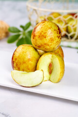 Fresh Red Jujube Dates with Slices on White Plate - Chinese Winter Fruit
