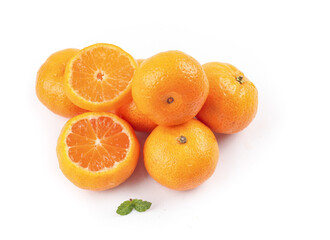Fresh Small Oranges Cut in Half on White Background with Mint Leaves