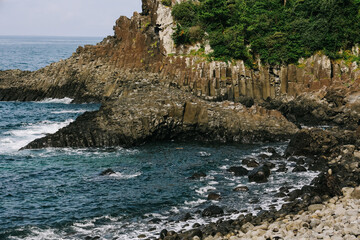 Jusangjeolli Cliff Columnar Joints and sea in Jeju Island, Korea.