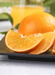 Fresh Ehime Orange Slices Display on Dark Tray - Japanese Citrus Fruit Produce