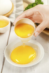 Fresh Farm Eggs Being Cracked into Bowl for Cooking Preparation