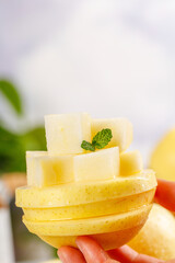 Golden Apple Slices with Mint Garnish - Fresh Fruit Stack in Hand