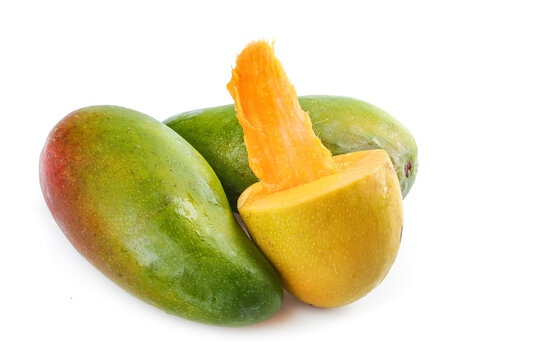 Fresh Green Mango Specialty from Guangxi Baise China with Peeled Orange Flesh on White Background
