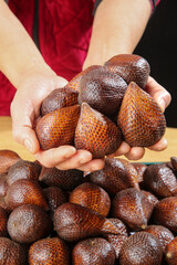 Fresh Salak Snake Fruit from Bali Indonesia Held in Hands - Exotic Tropical Produce with Scaly Brown Skin