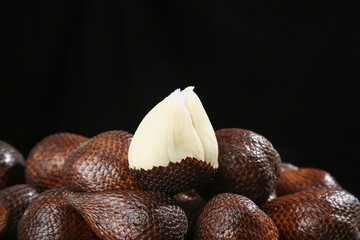 Snake Fruit Salak with Peeled Fresh White Flesh and Scaly Brown Skin Texture