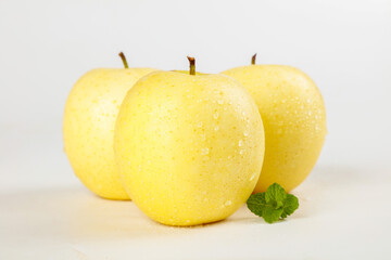 Fresh Golden Yellow Apples with Water Droplets on White Background - Healthy Organic Fruit