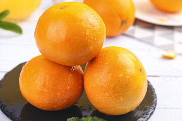 Fresh Ripe Oranges on Dark Plate - Healthy Citrus Fruit Display for Cooking and Nutrition