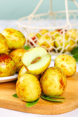 Fresh Jujube Dates from Shaanxi China on Wooden Board with Basket - Healthy Asian Fruit Snack