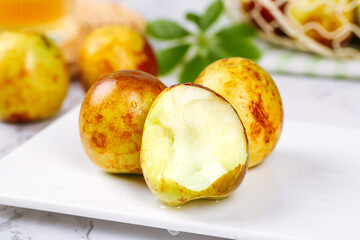 Fresh Golden Jujube Fruits Cut in Half Showing White Flesh - Sweet Chinese Dates