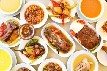 Delicious meat kebab with fresh vegetable salad served with variety of Turkish dishes and appetizers. Top view of assorted Turkish food and meze, tasty and healthy Mediterranean cuisine. Top view.