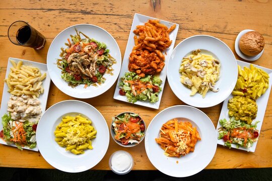 Delicious meat kebab with fresh vegetable salad served with variety of Turkish dishes and appetizers. Top view of assorted Turkish food and meze, tasty and healthy Mediterranean cuisine. Top view.