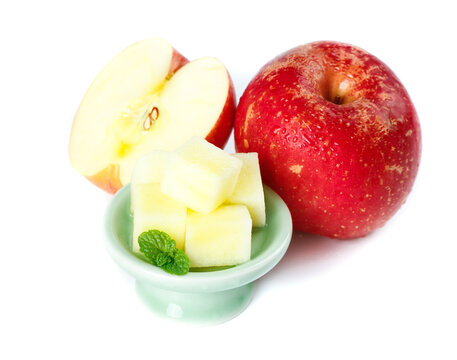 Fresh Red Apple Slices with Honey Cubes and Mint on White Background