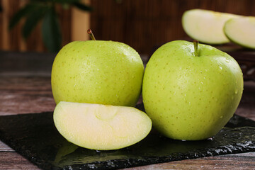 Fresh Green Apples with Water Droplets on Slate Board - Healthy Organic Fruit