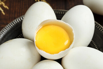 Fresh Goose Eggs Display on Tray with Cracked Open Egg Showing Bright Yolk