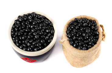 Black beans in bowl and burlap sack - healthy cooking ingredients and legumes for nutritious meals