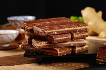 Handmade Brown Sugar Chocolate Bars Stack on Rustic Wooden Board - Artisanal Confectionery Display