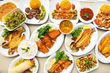 Delicious meat kebab with fresh vegetable salad served with variety of Turkish dishes and...